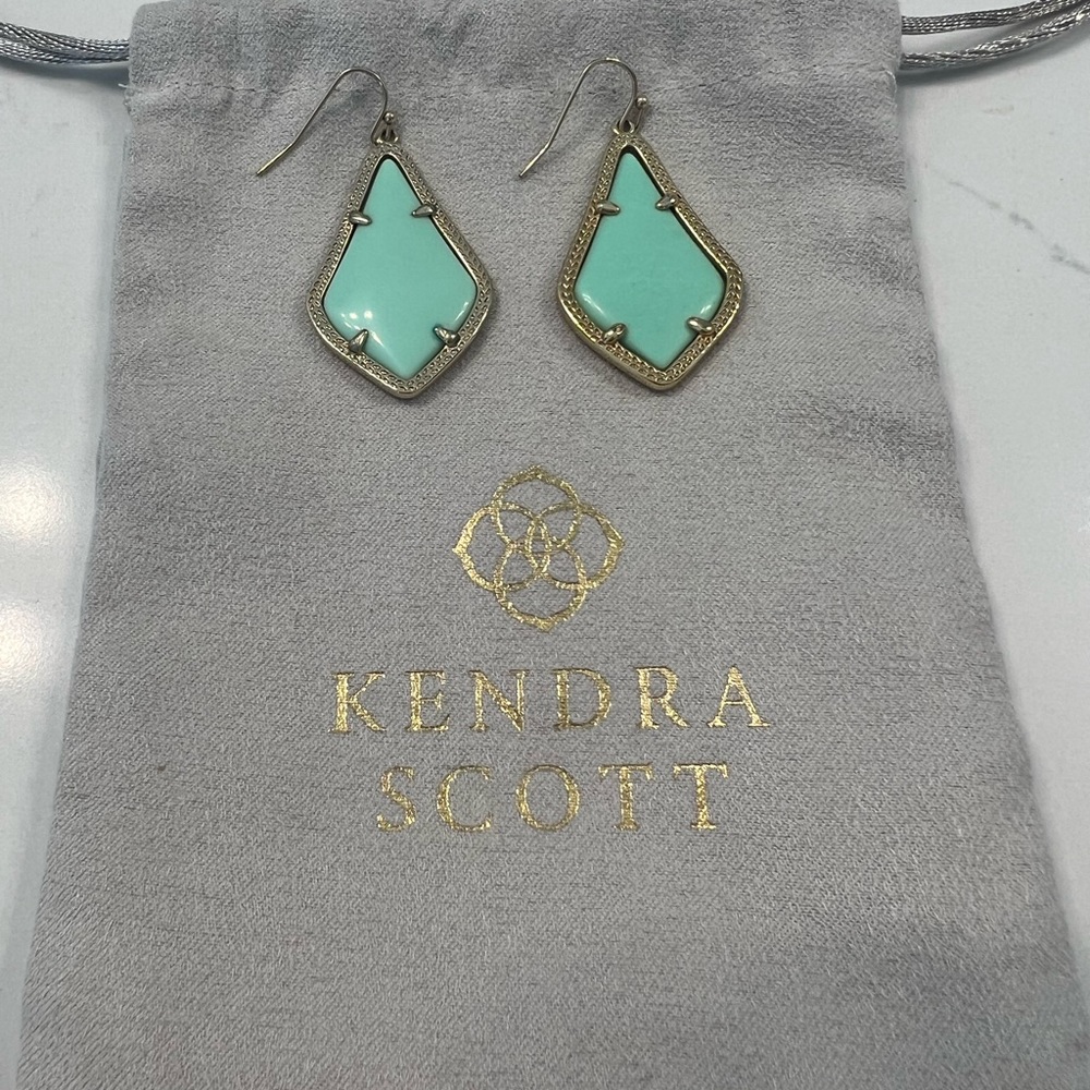 Kendra Scott mint gold earrings.